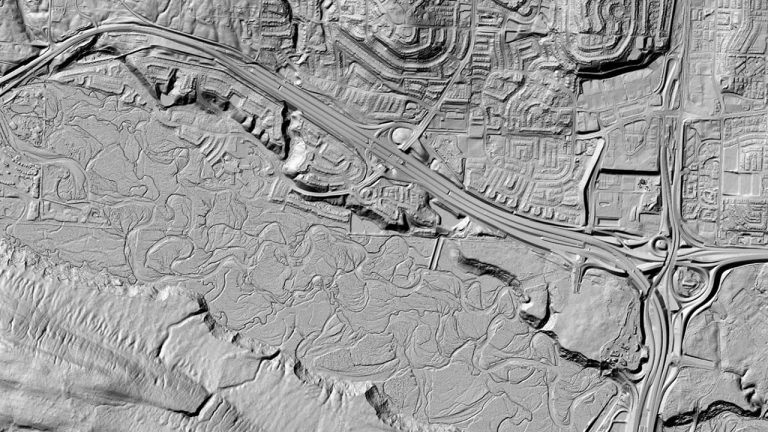View of the digital surface model of an area with a river, buildings and roads.