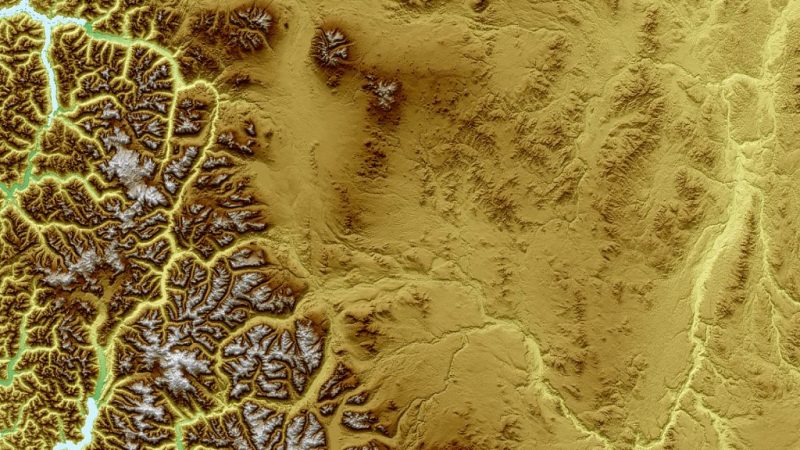 An sepia-toned aerial view of Canadian elevation features using slope, shaded relief and colour shaded relief maps